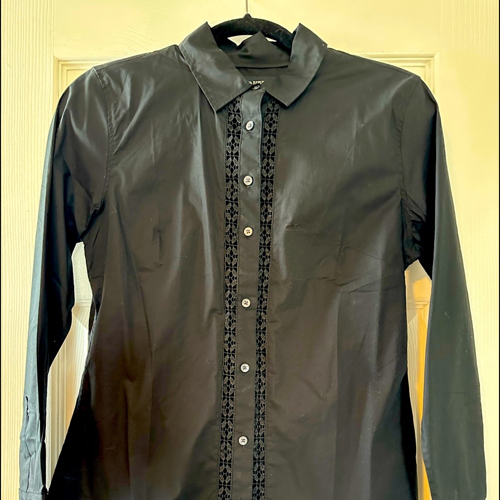 long sleeve button down shirt with lace detail at buttons.